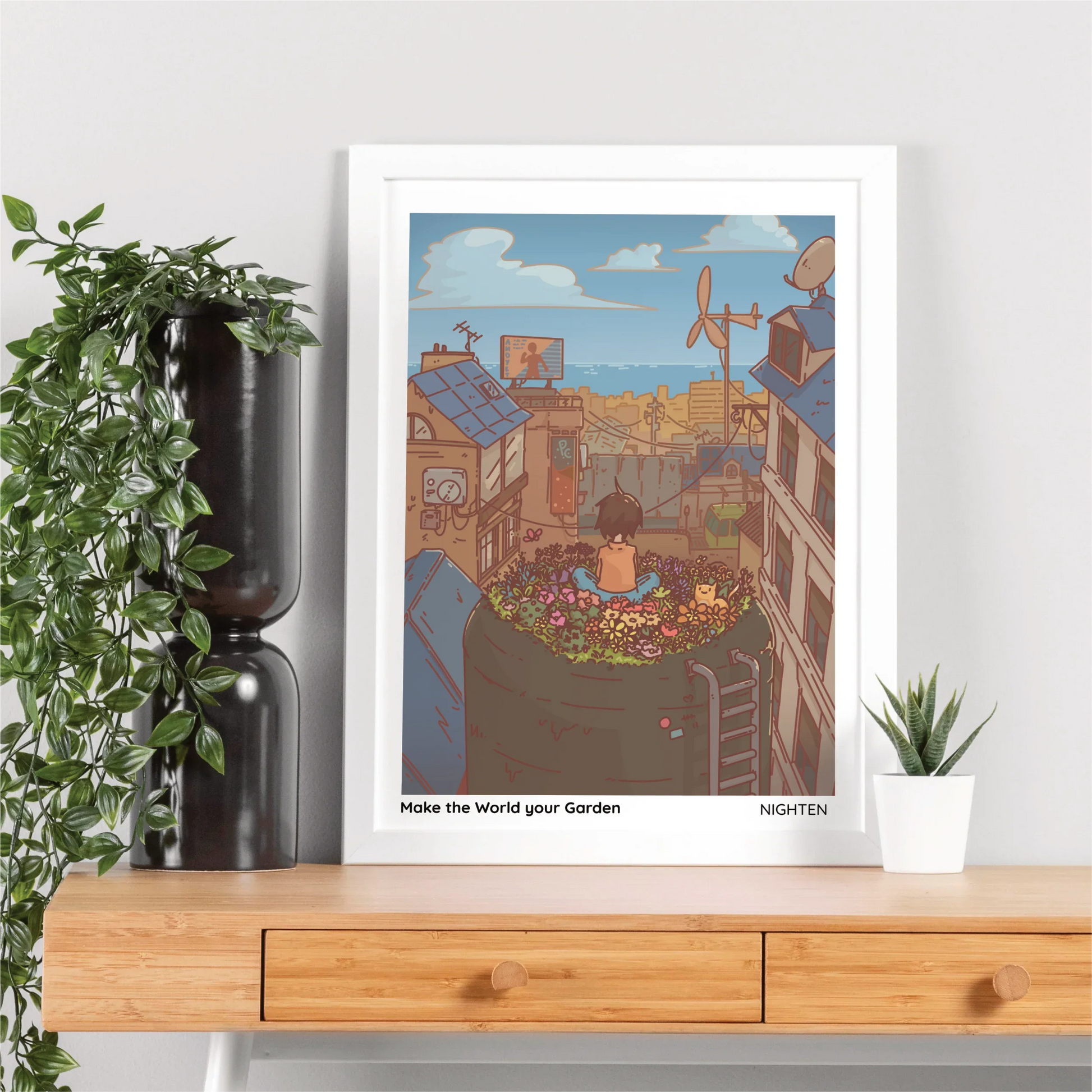 Framed artwork on a wooden shelf with plants