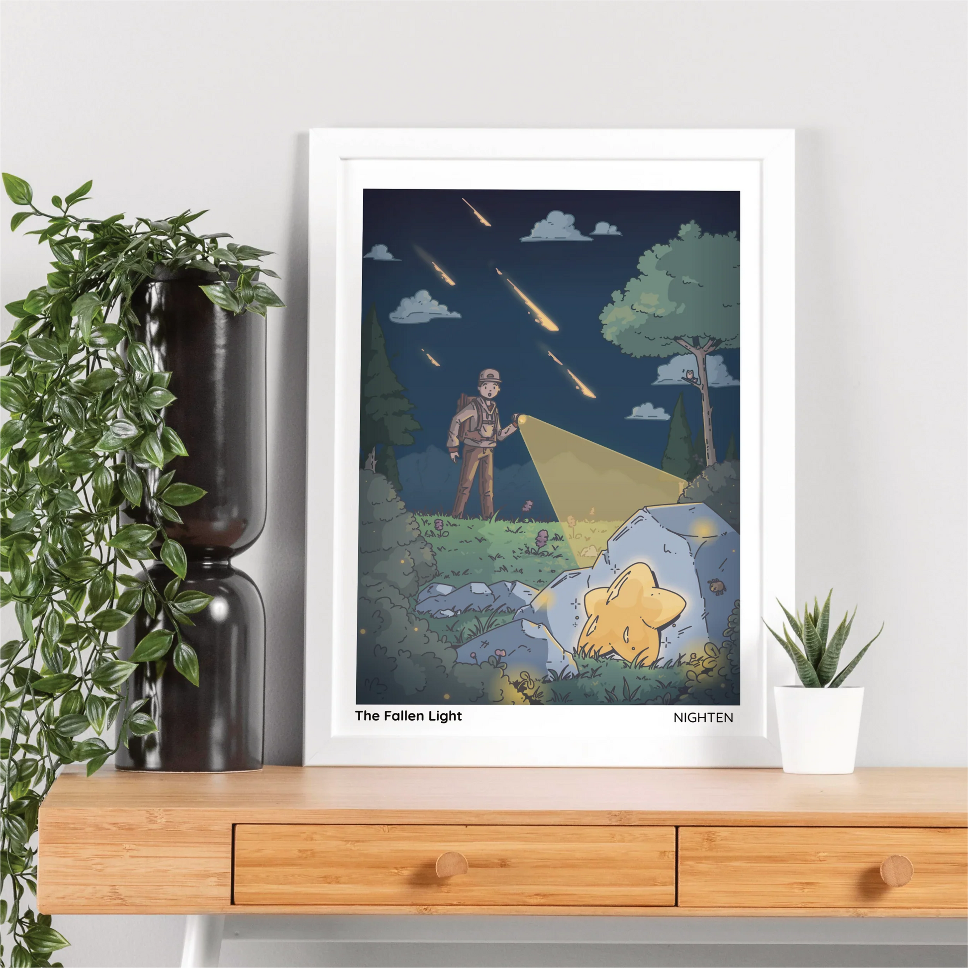 Framed artwork of a person with a lantern and a star on a wooden shelf.